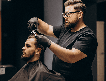 Hair salon professional working on client