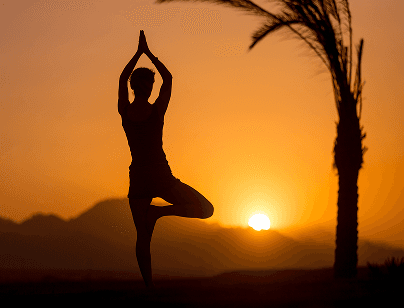 Wellness and yoga silhouette at sunset